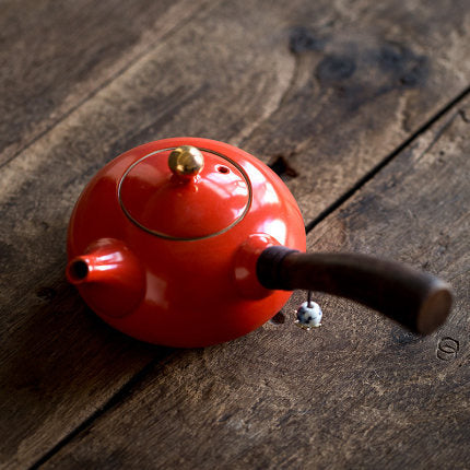 Ceramic teapot with wooden handle