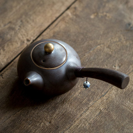 Ceramic teapot with wooden handle