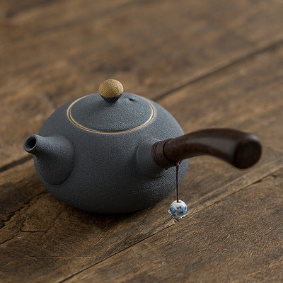 Ceramic teapot with wooden handle