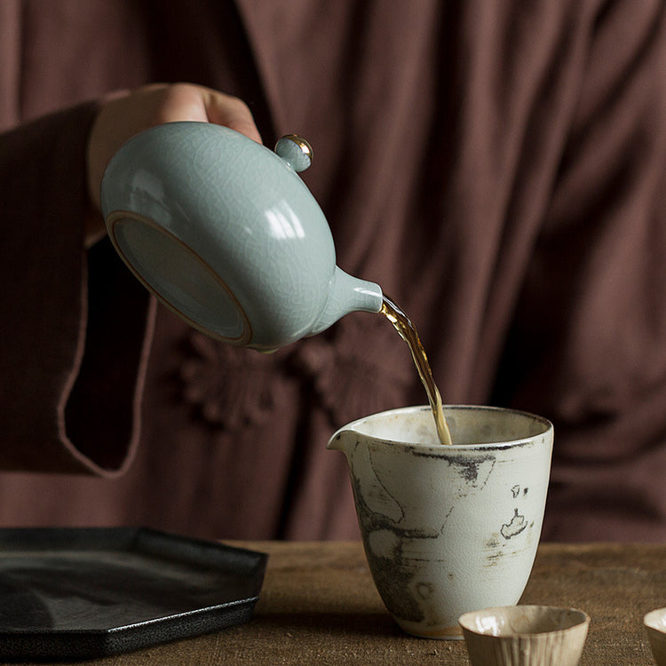 Ceramic teapot with wooden handle