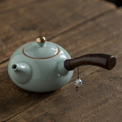 Ceramic teapot with wooden handle